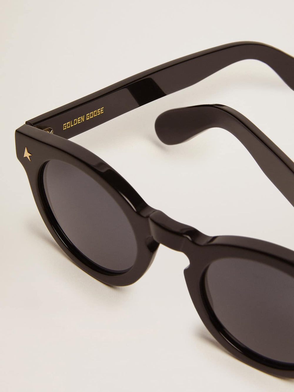 Golden Goose Sunframe Panthos model with black frame and gold details