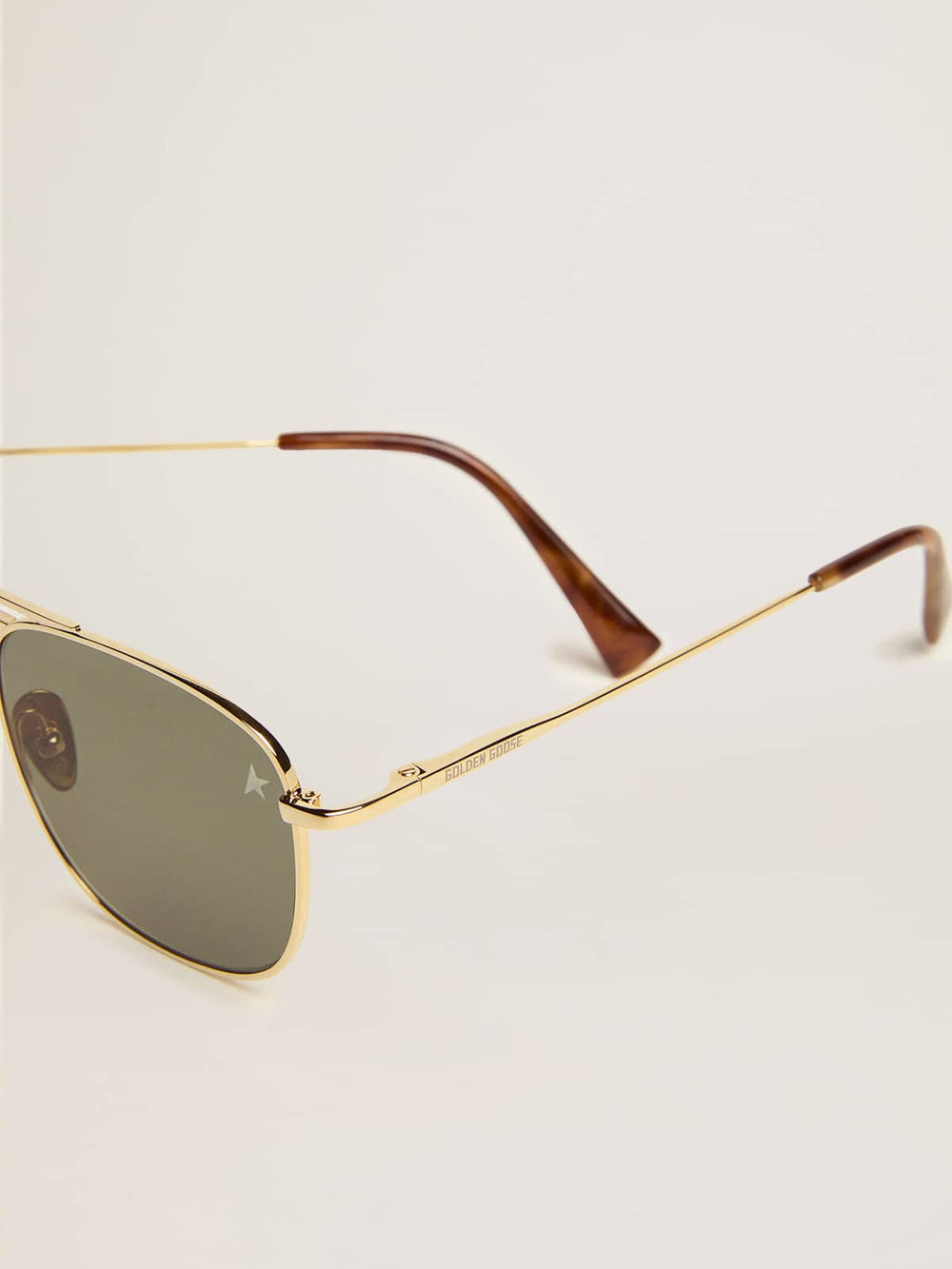 Golden Goose Aviator sunglasses with gold frame and green lenses