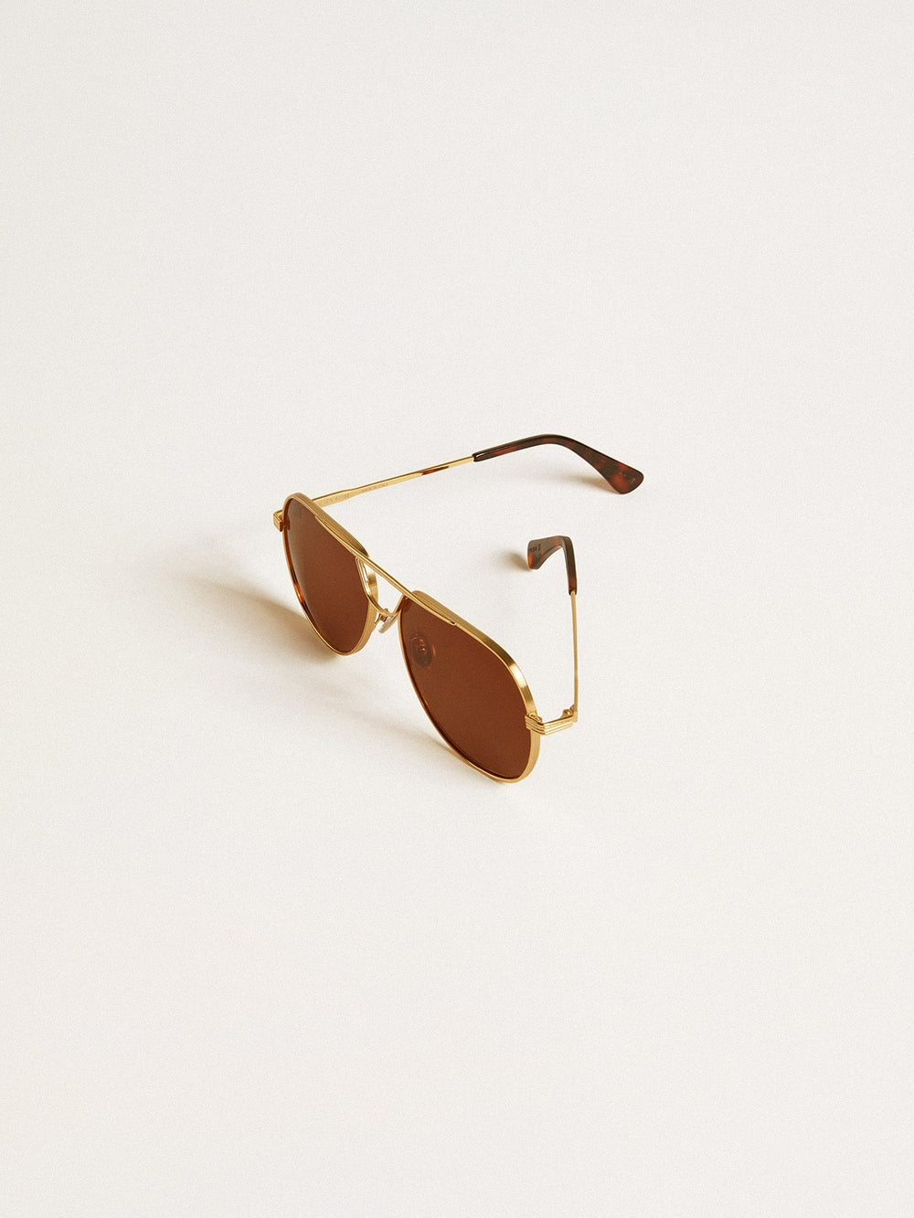 Golden Goose Aviator style sunglasses with gold frame and brown lenses