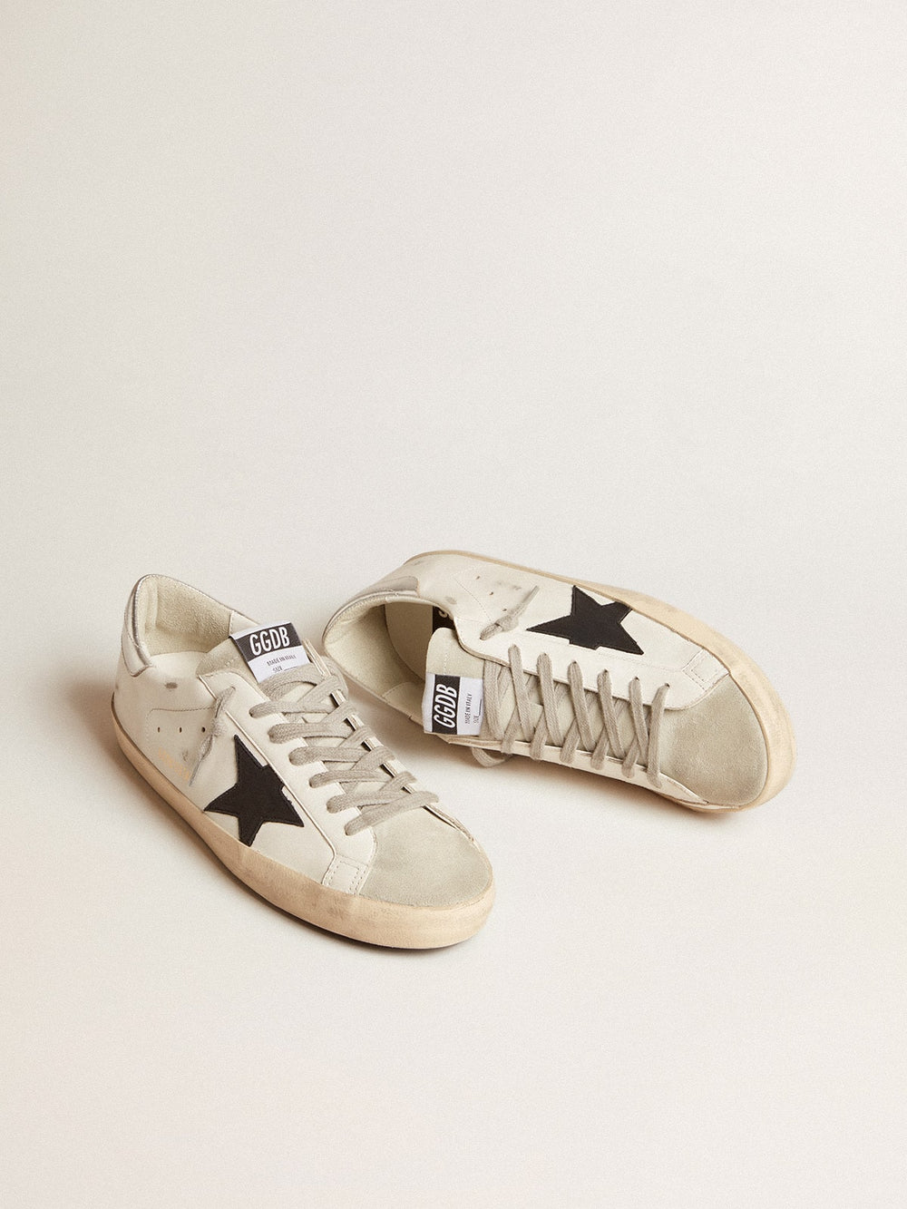 Golden Goose Men's Super-Star in white leather with black nubuck star and silver metallic leather heel tab