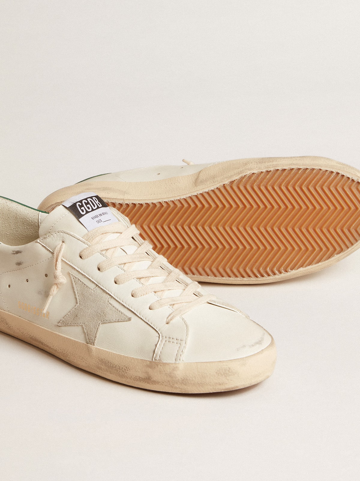 Golden Goose Super-Star in white leather with ice-gray suede star and green leather heel tab