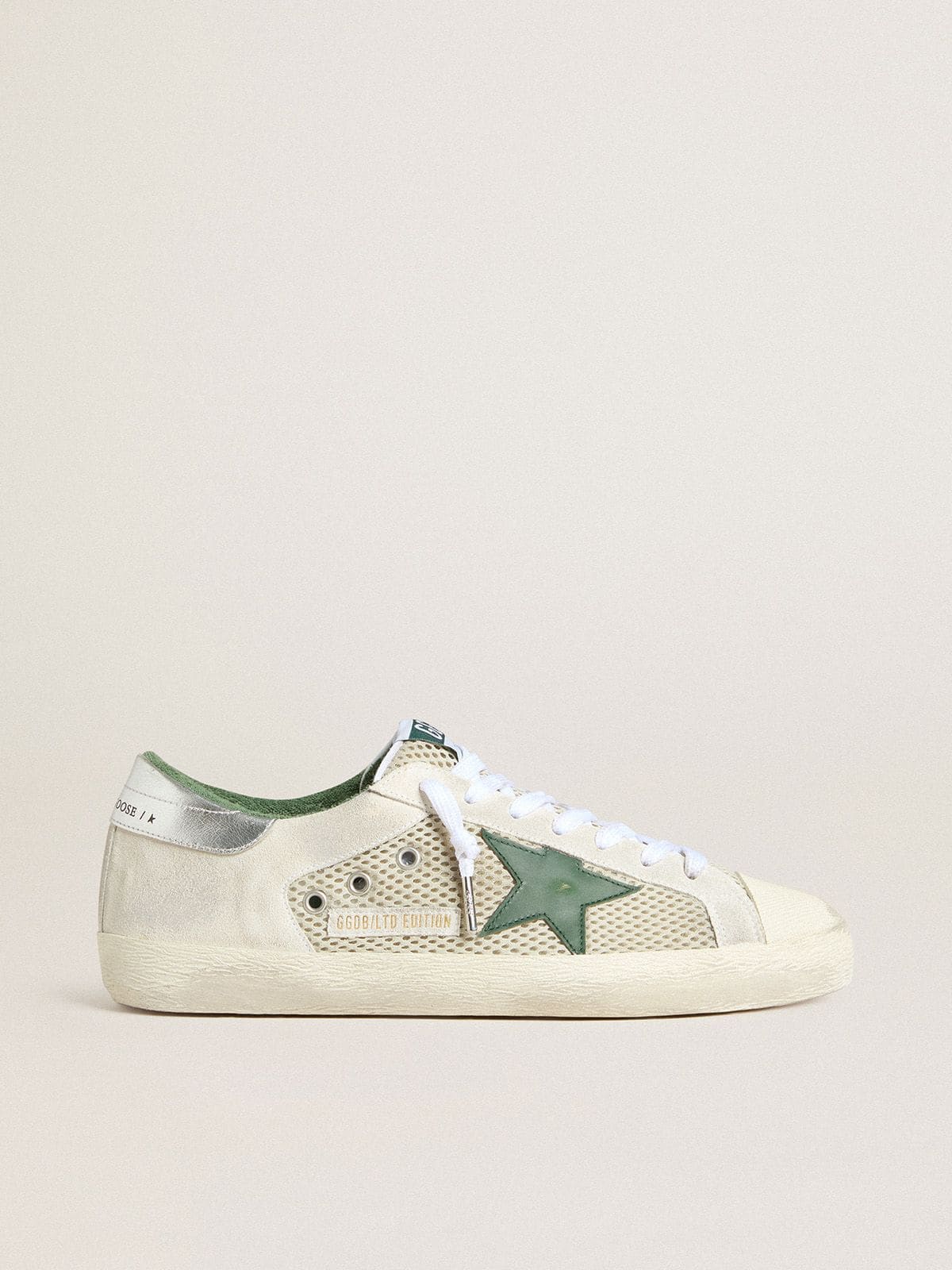 Golden Goose Men’s Super-Star LTD in white suede and mesh with green leather star and silver heel tab