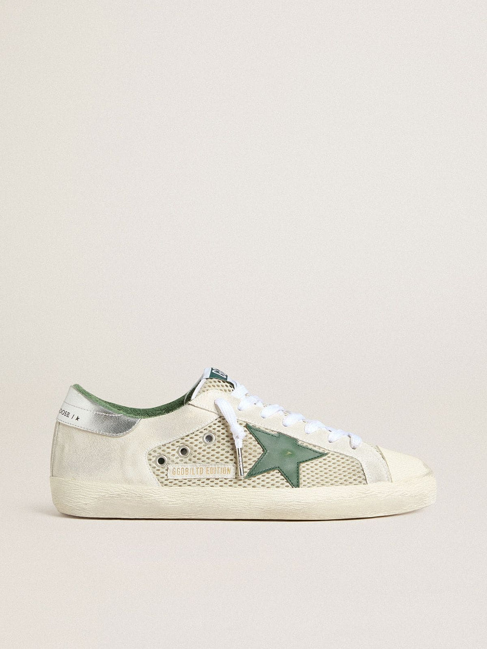 Golden Goose Men’s Super-Star LTD in white suede and mesh with green leather star and silver heel tab