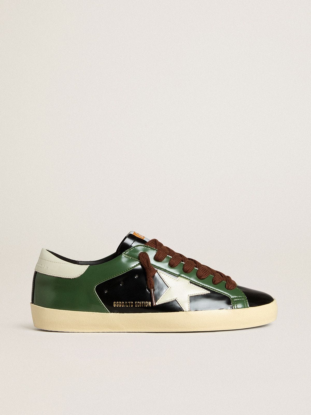 Golden Goose Men’s Super-Star LTD in black laminated leather with white leather star and heel tab