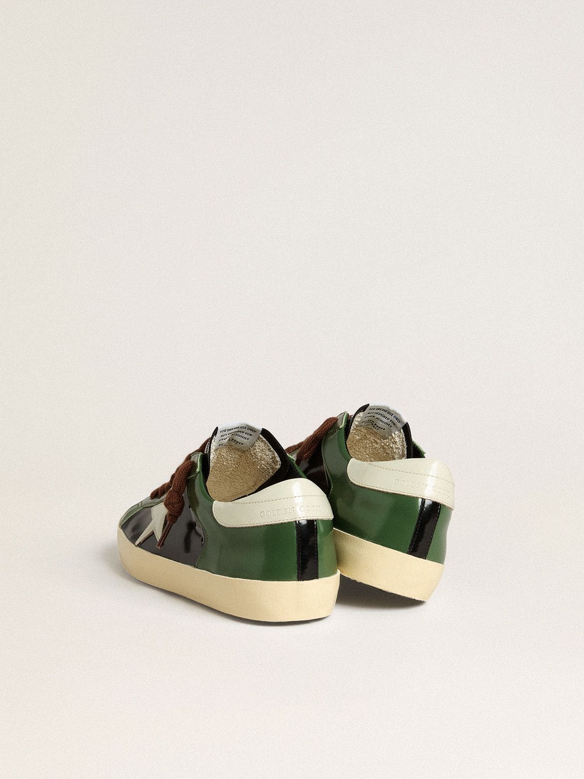 Golden Goose Men’s Super-Star LTD in black laminated leather with white leather star and heel tab