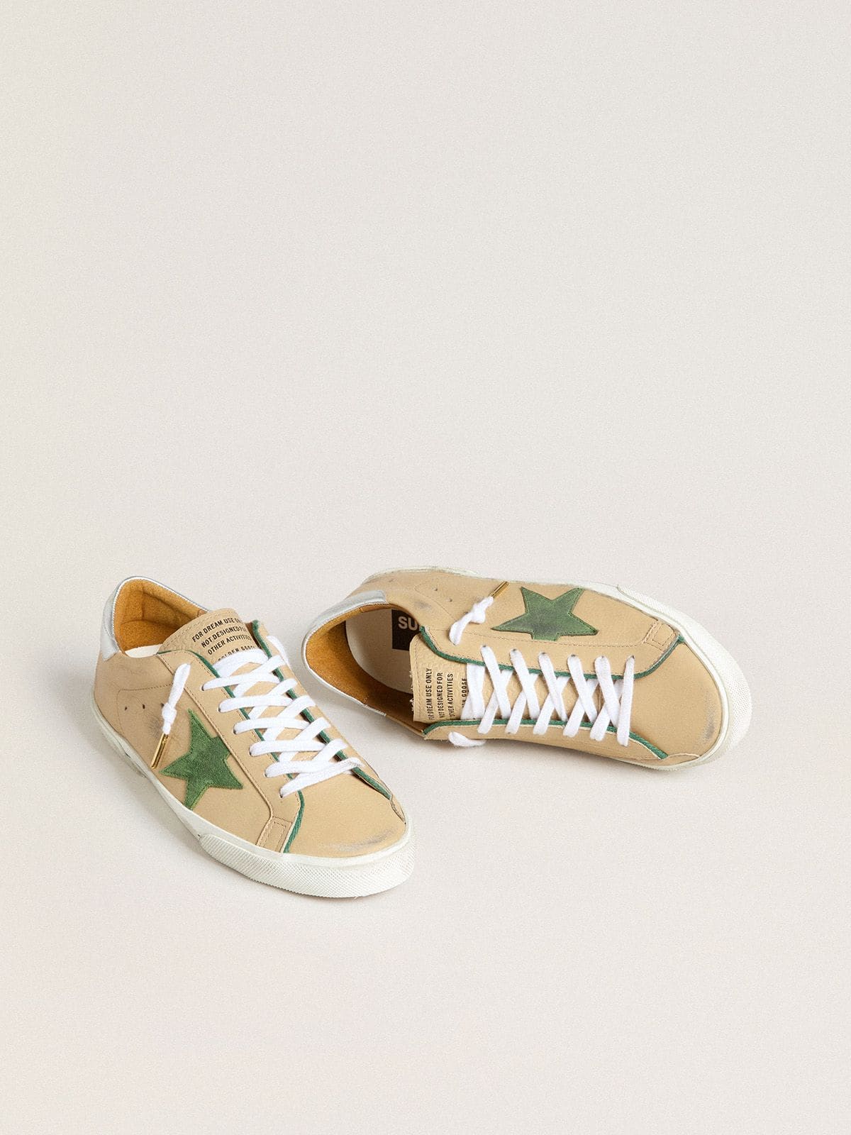Golden Goose Super-Star LTD in beige leather with green suede star and silver foiled leather heel tab