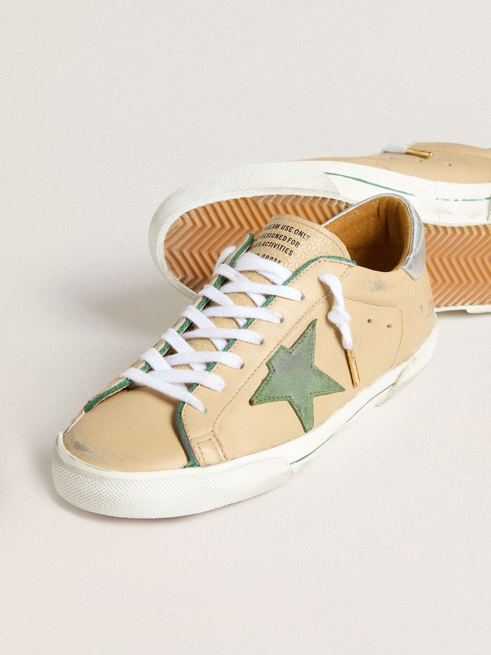 Golden Goose Super-Star LTD in beige leather with green suede star and silver foiled leather heel tab