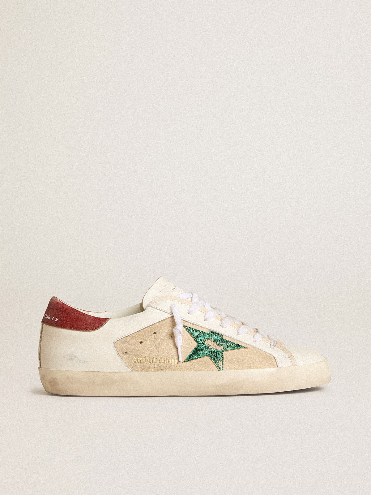 Golden Goose Men's Super-Star LTD in suede with green metallic star and red heel tab
