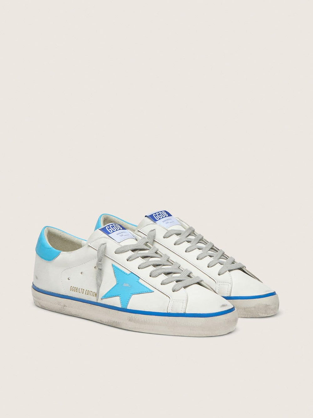 Golden Goose Men's Super-Star LTD in white leather with light blue leather star and heel tab