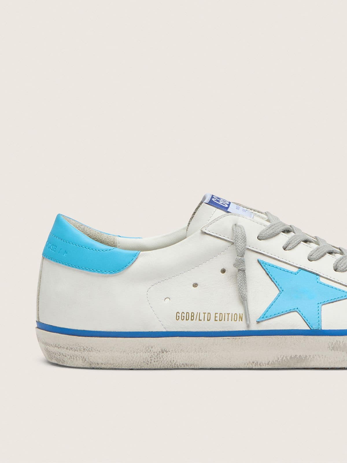 Golden Goose Men's Super-Star LTD in white leather with light blue leather star and heel tab