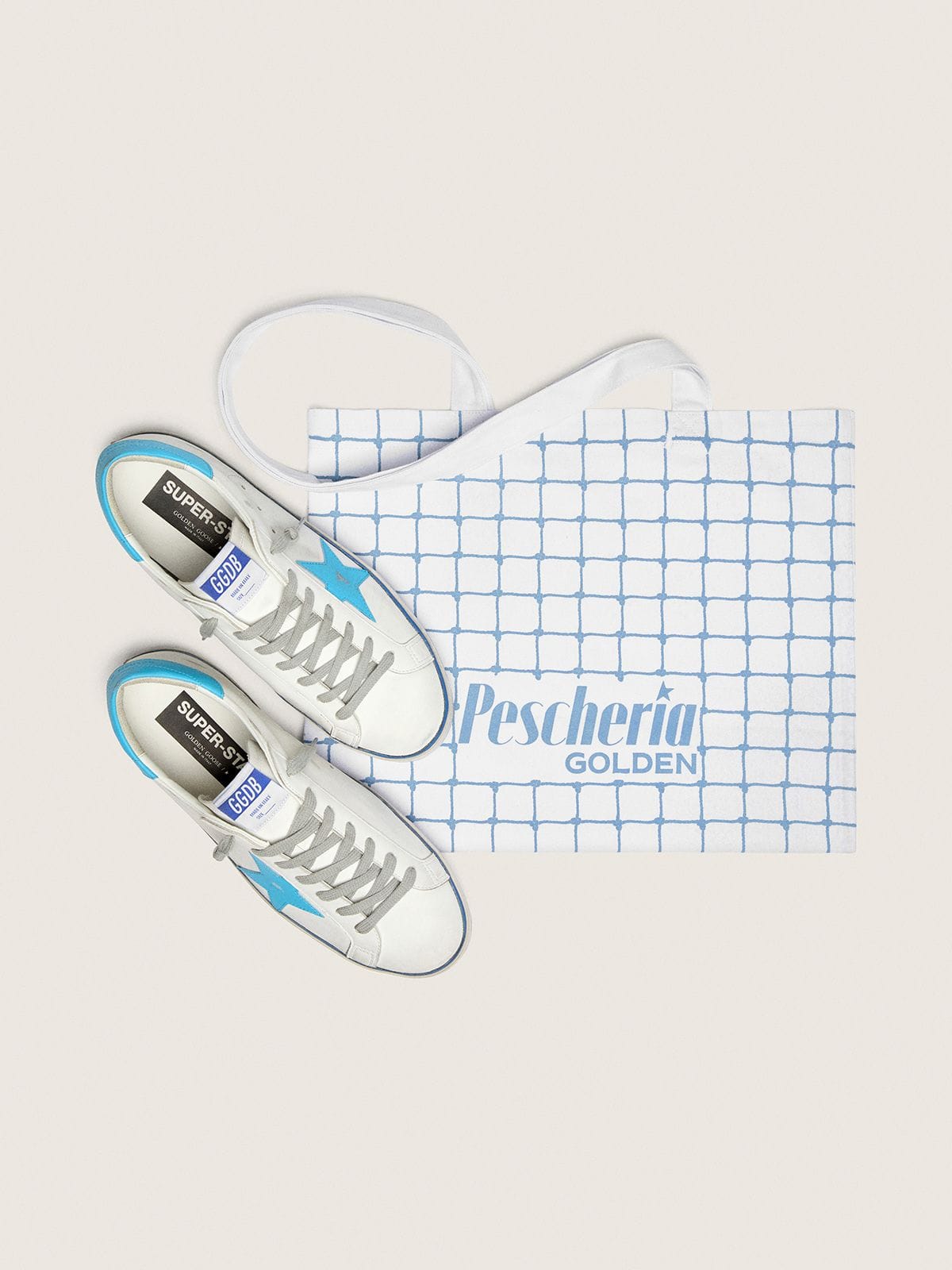 Golden Goose Men's Super-Star LTD in white leather with light blue leather star and heel tab