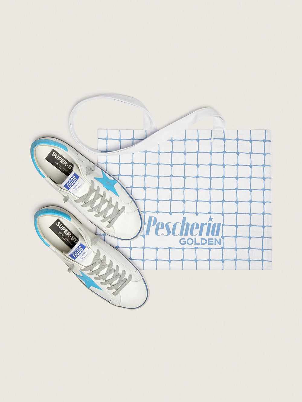 Golden Goose Men's Super-Star LTD in white leather with light blue leather star and heel tab