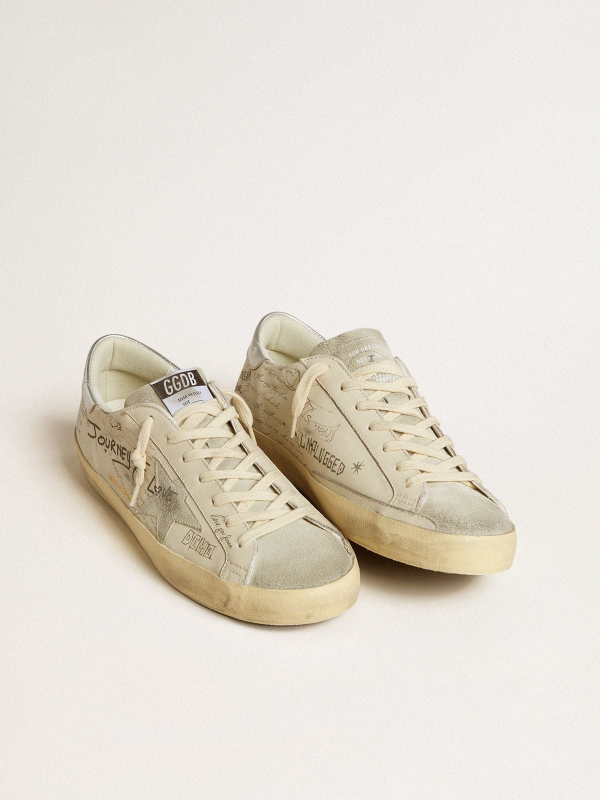 Golden Goose Men's Super-Star  in white leather with all-over lettering and ice-gray suede star