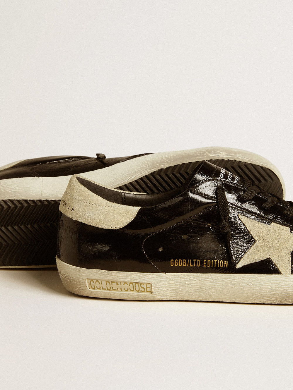 Golden Goose Men's Super-Star  in black patent leather with suede star and heel tab