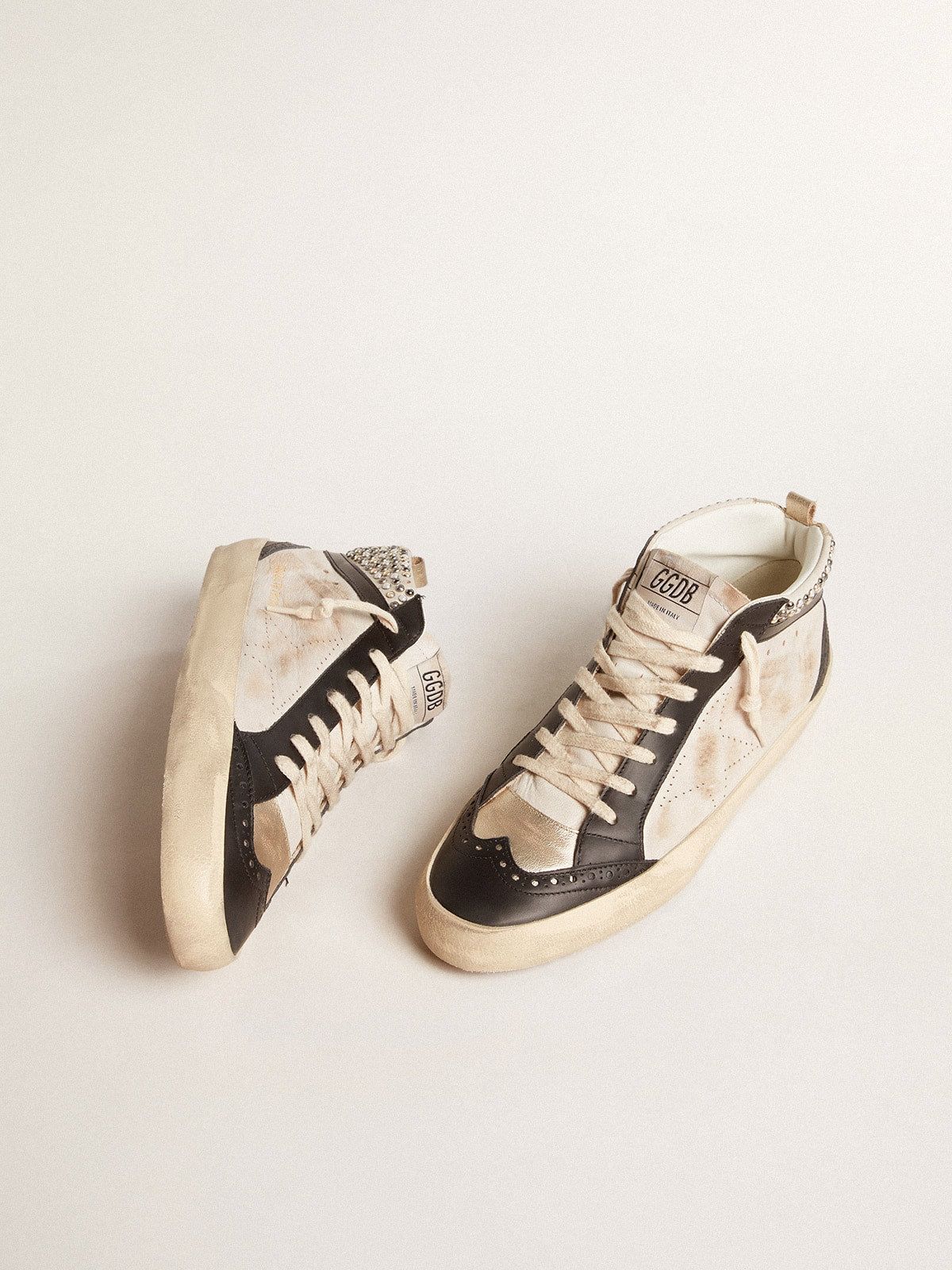 Golden Goose Men’s Mid Star LTD in black and white leather with pearls and perforated star