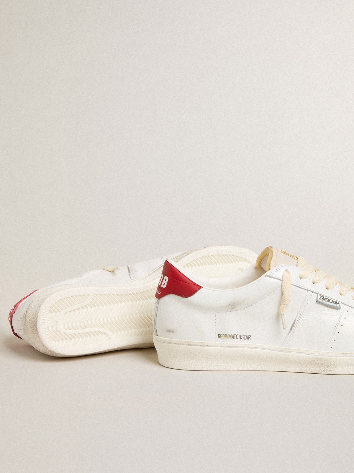 Golden Goose Matchstar in glossy white leather with glossy red leather heel tab