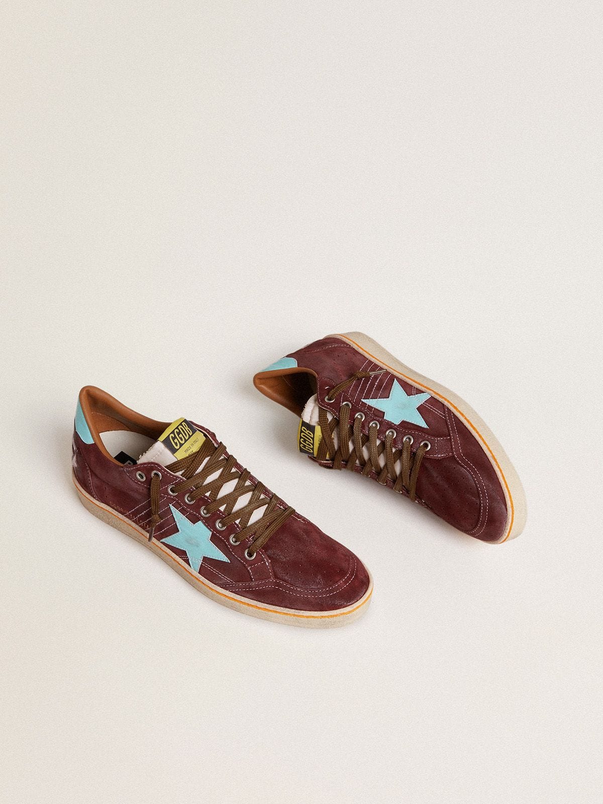 Golden Goose Men’s Ball Star in dark red suede with light blue star and heel tab