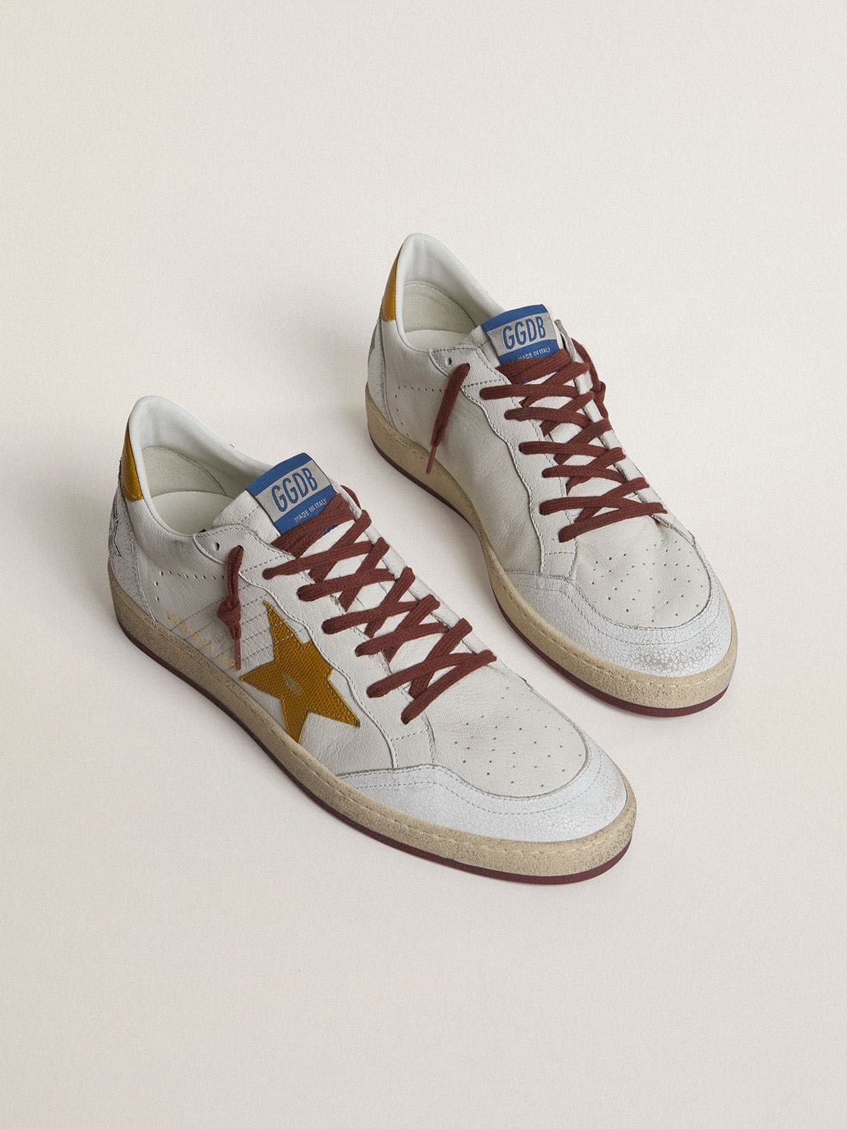 Golden Goose Men's Ball Star in white nappa leather with yellow animal-print leather star and heel tab