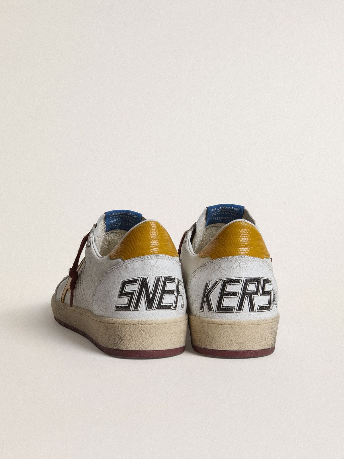 Golden Goose Men's Ball Star in white nappa leather with yellow animal-print leather star and heel tab
