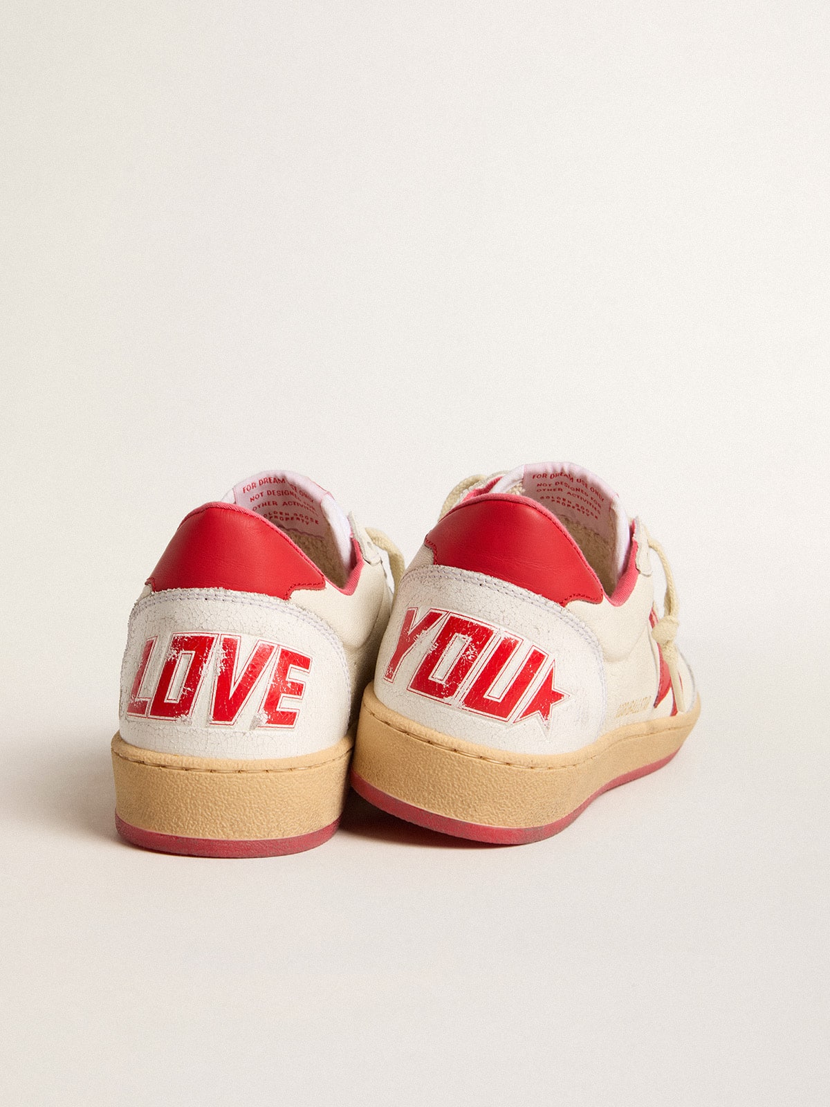 Golden Goose Men’s Ball Star Wishes in white leather with a red star and heel tab