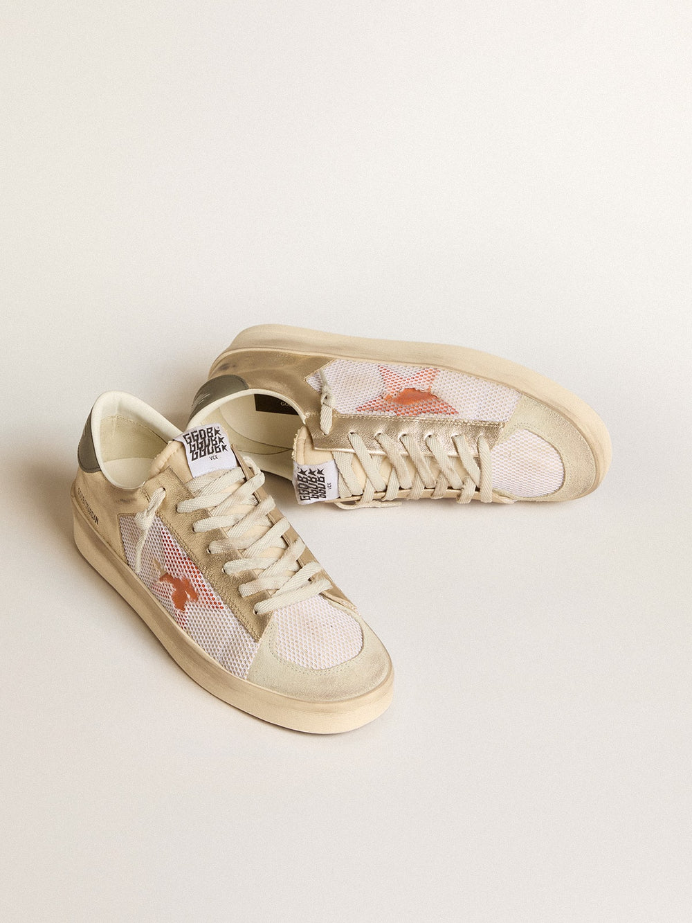 Golden Goose Stardan in white mesh with orange star and platinum leather inserts