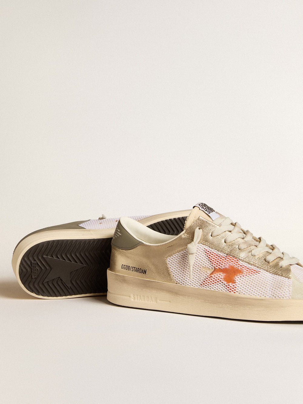 Golden Goose Stardan in white mesh with orange star and platinum leather inserts