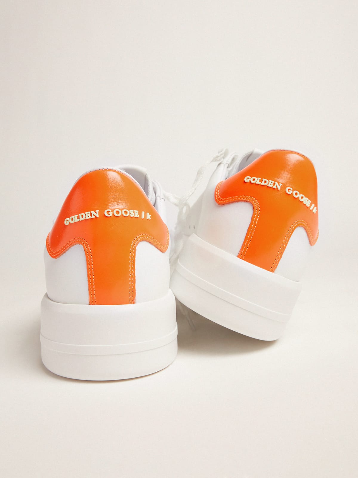 Golden Goose White Purestar sneakers with fluorescent orange heel tab