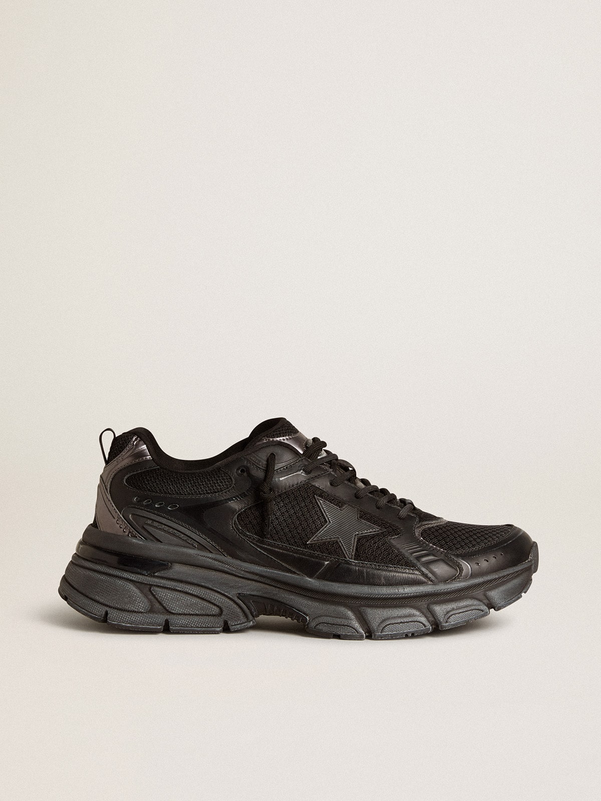 Golden Goose Men’s Lightstar with black leather and mesh upper and black star