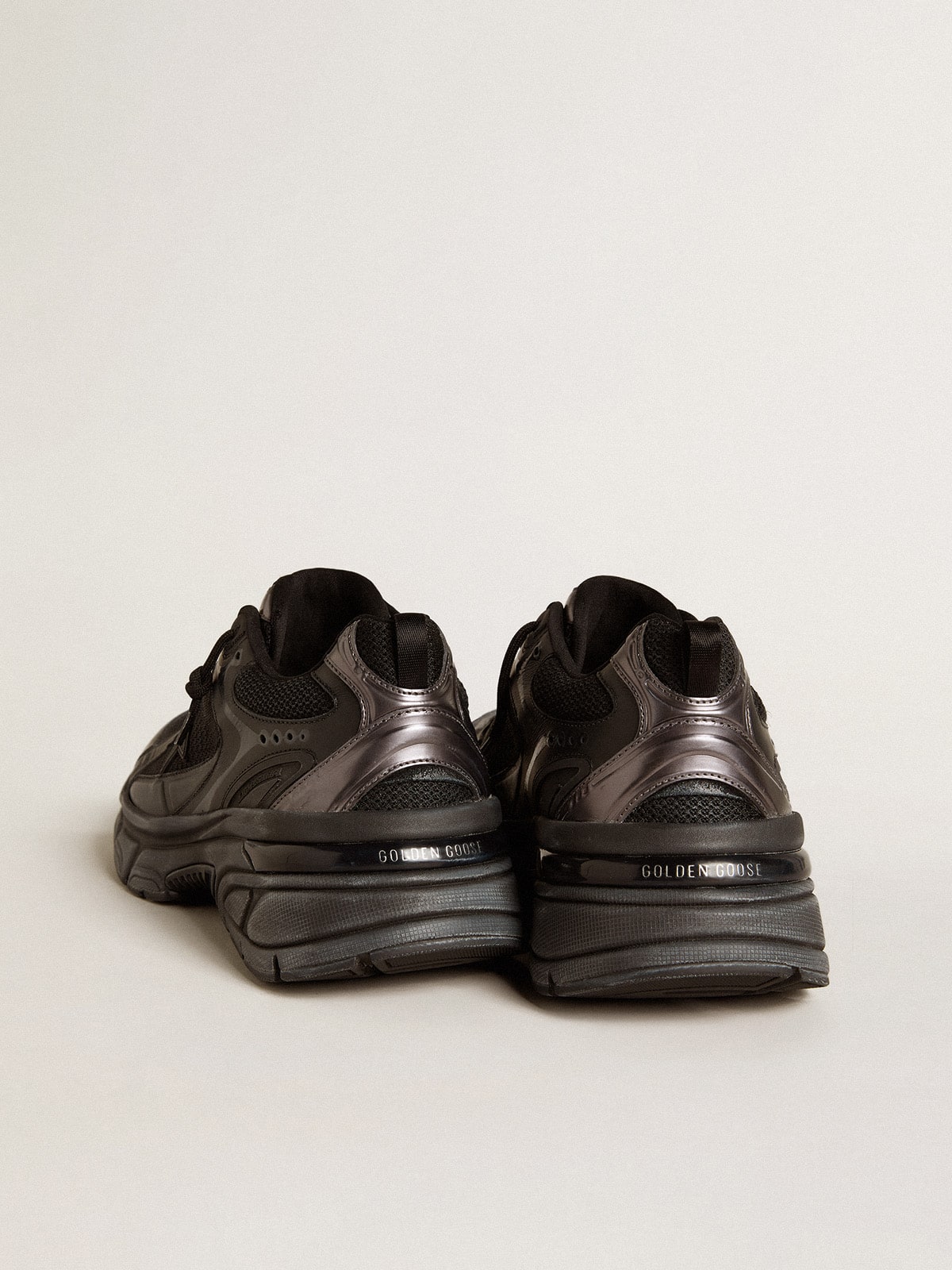Golden Goose Men’s Lightstar with black leather and mesh upper and black star