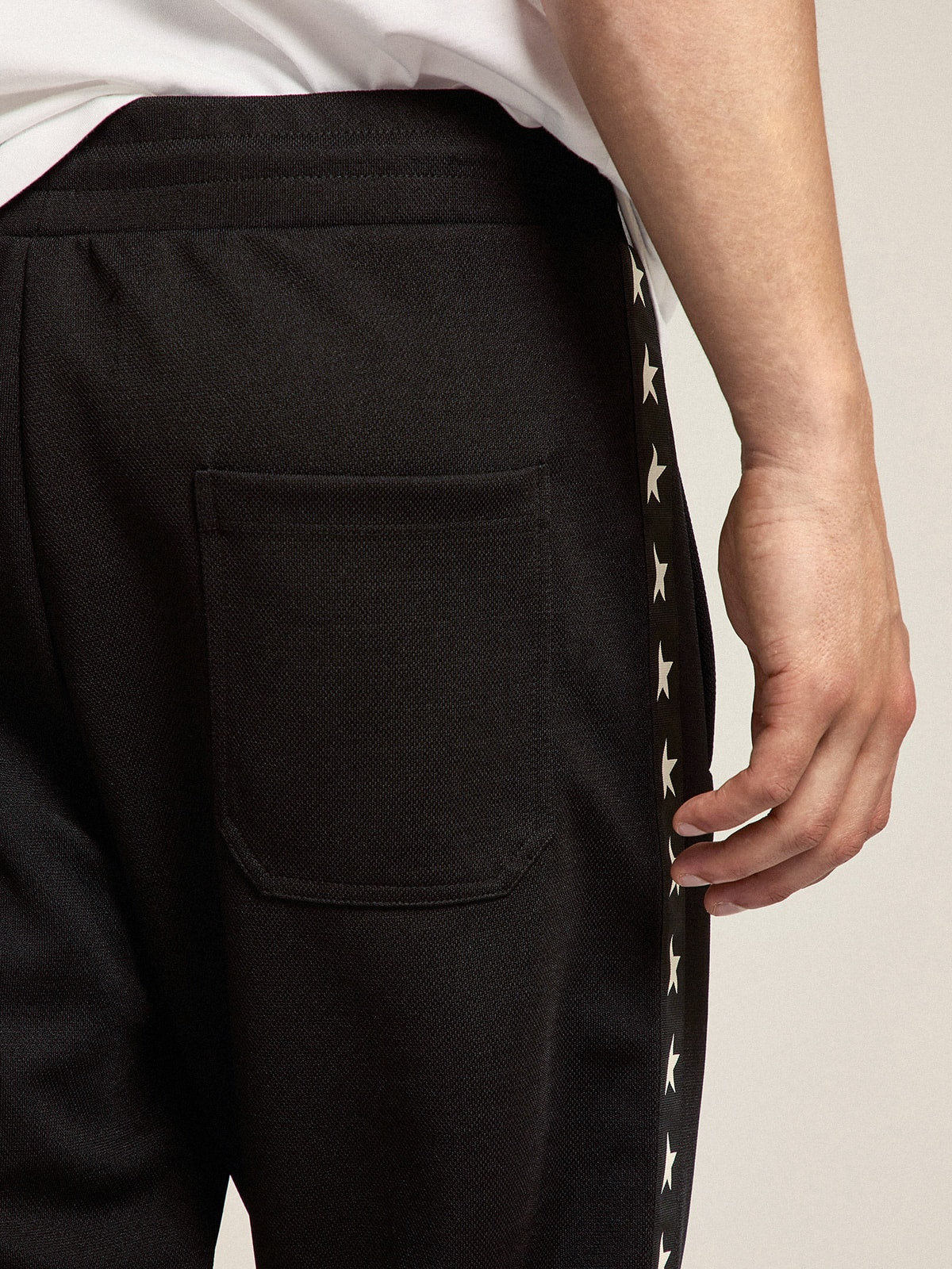 Golden Goose Men's black joggers with white stars on the sides