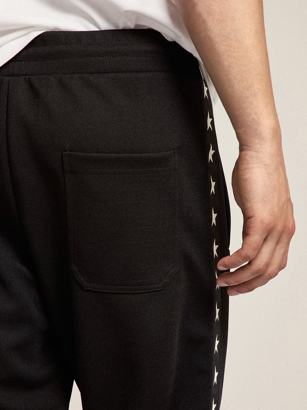 Golden Goose Men's black joggers with white stars on the sides