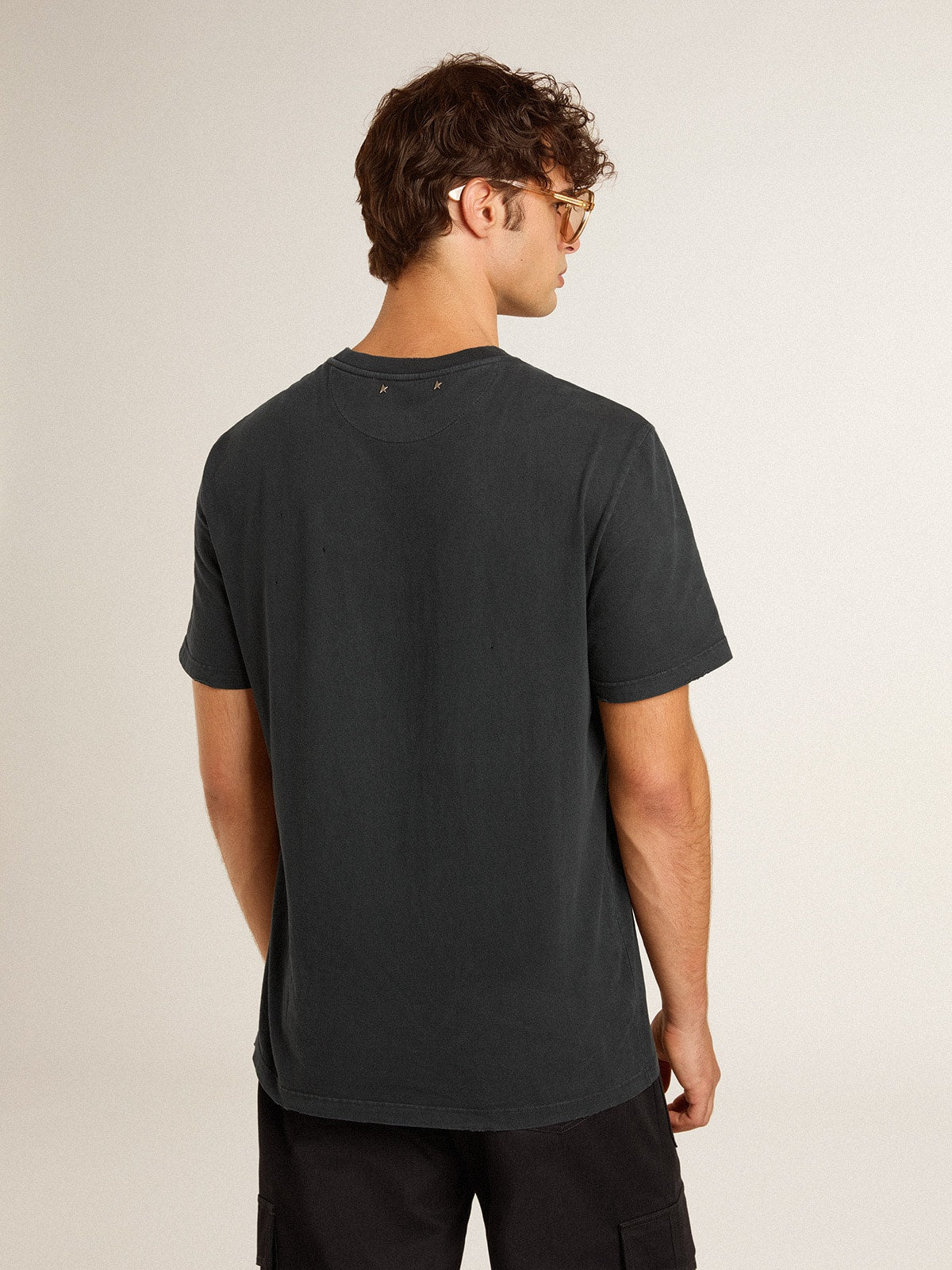 Golden Goose Men’s worn-black cotton T-shirt with print on the front