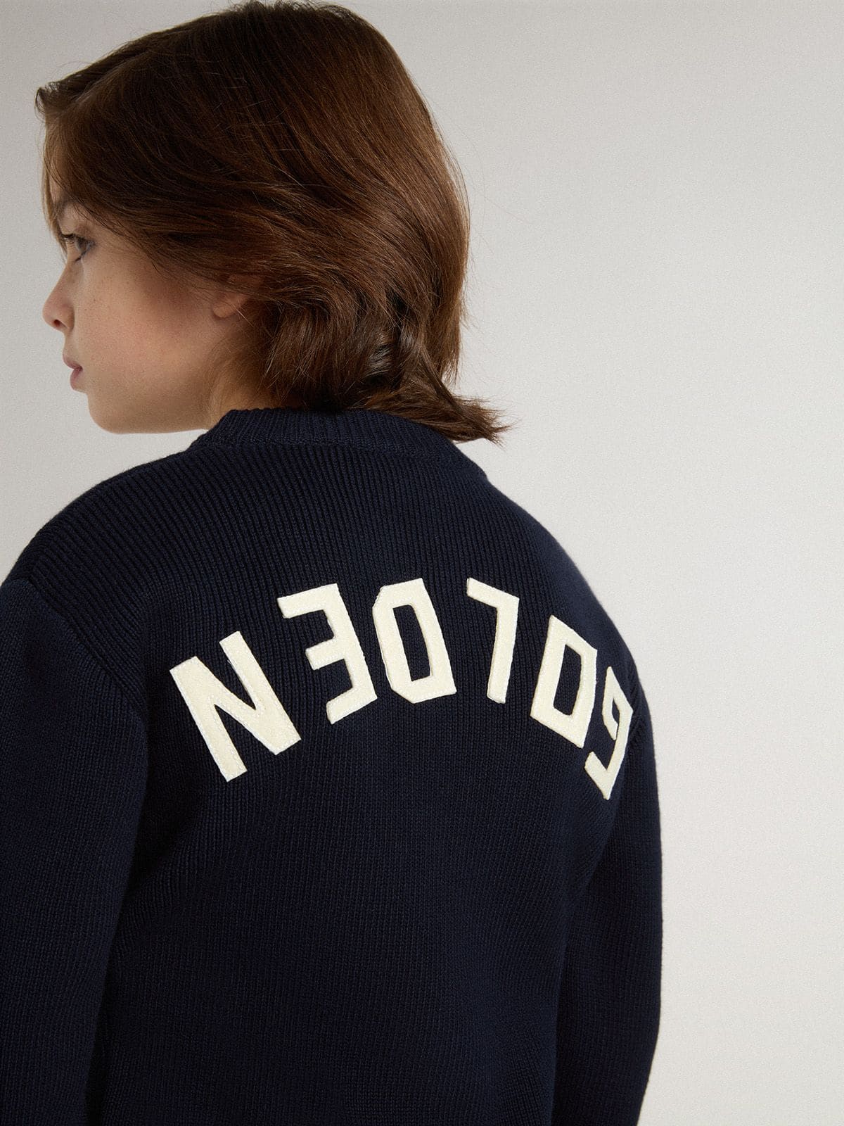 Golden Goose Boys’ blue crew-neck sweater with 'Golden' lettering on the back
