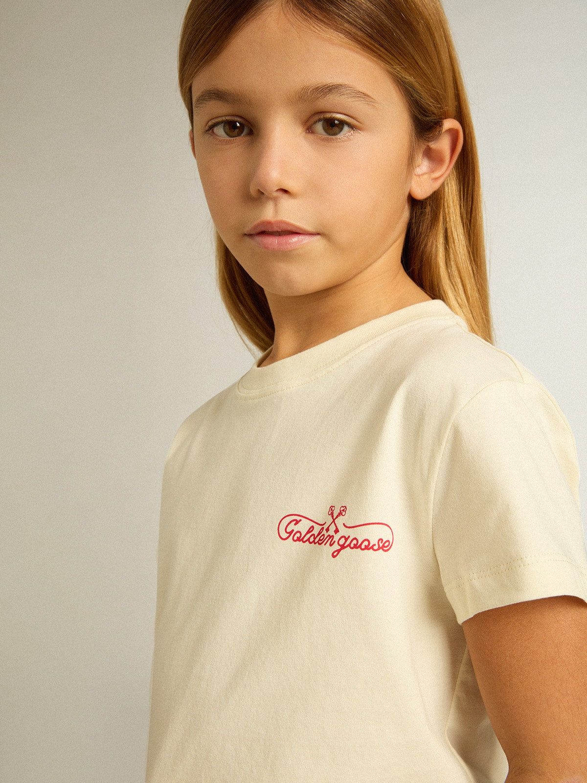 Golden Goose Girls' cotton T-shirt in worn white with red embroidery on the chest