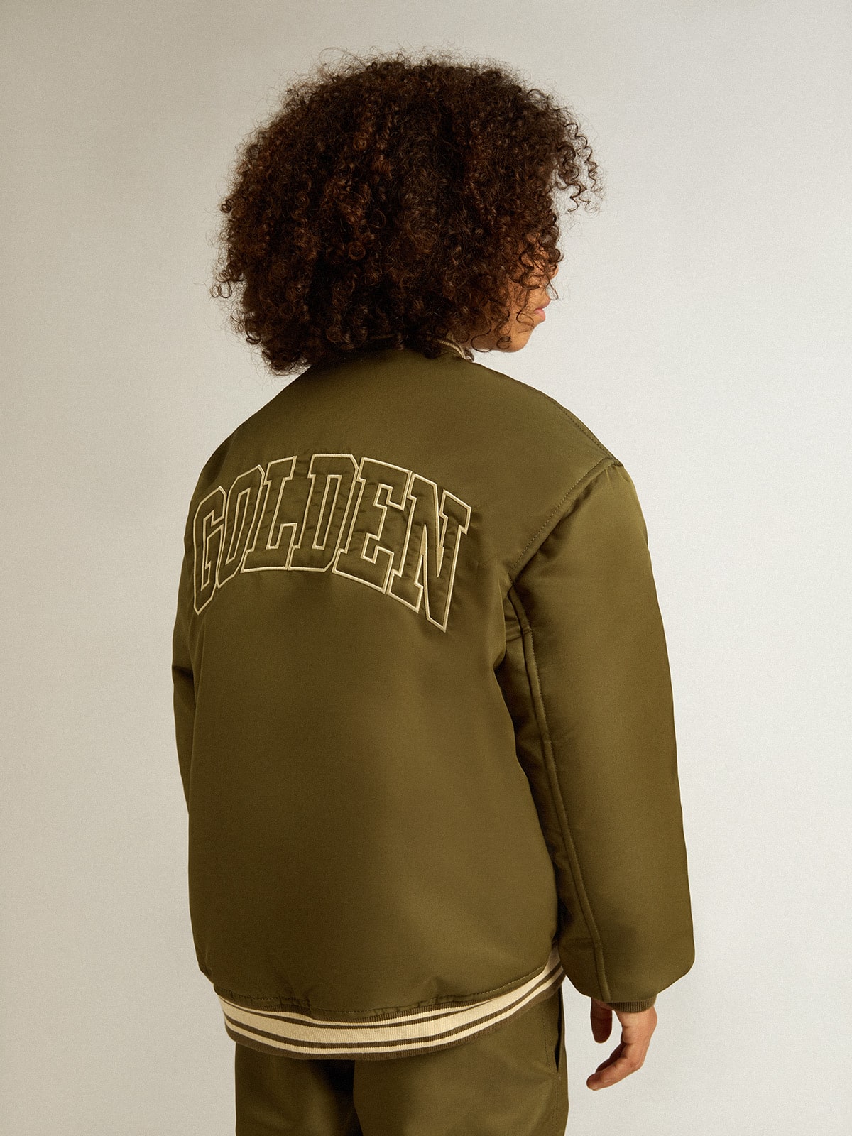 Golden Goose Kids military-green nylon bomber jacket with lettering on the back