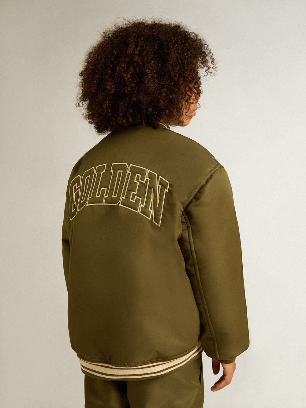 Golden Goose Kids military-green nylon bomber jacket with lettering on the back