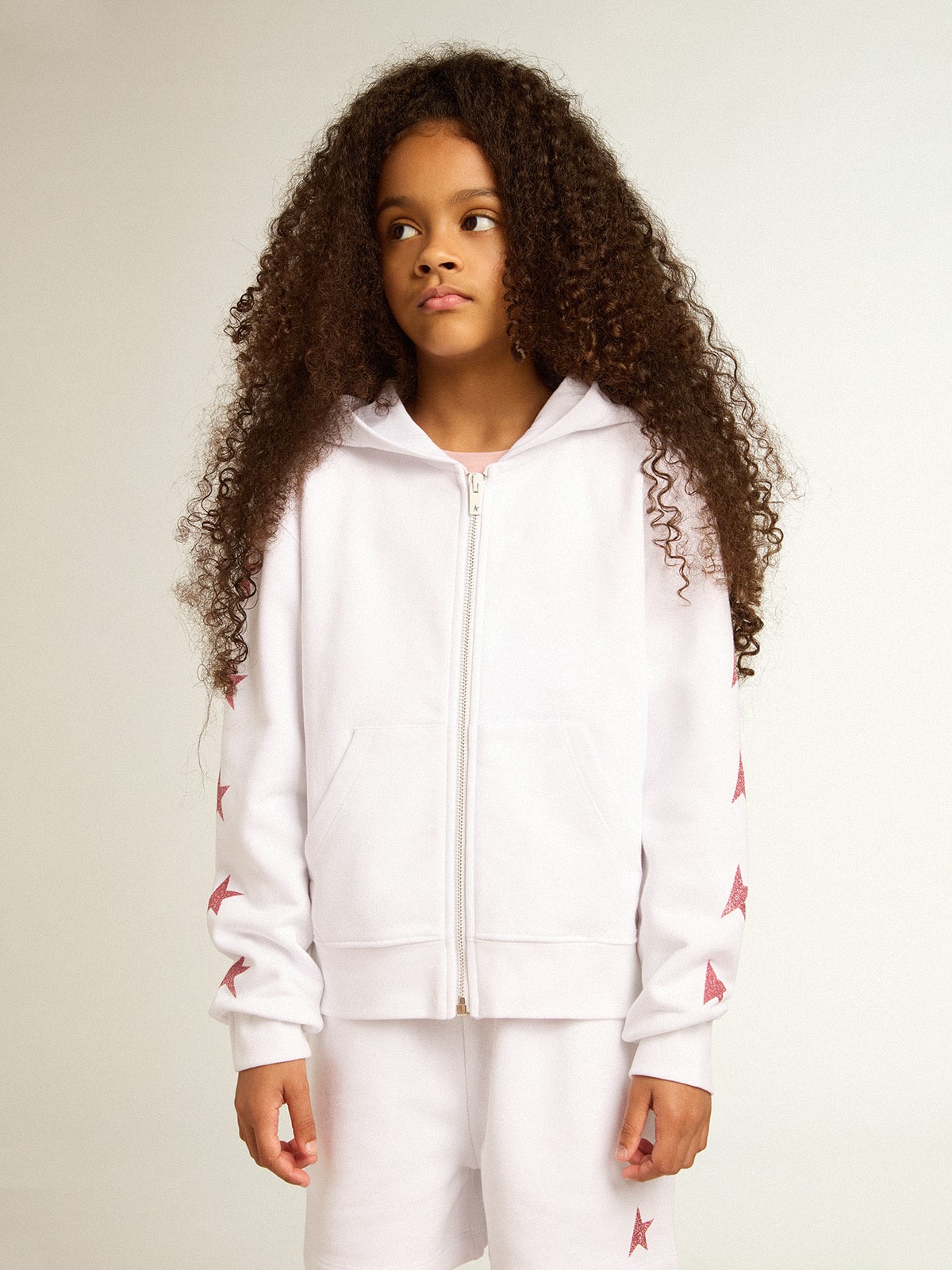 Golden Goose Girls’ zip-up sweatshirt in white with glitter stars on the sleeves