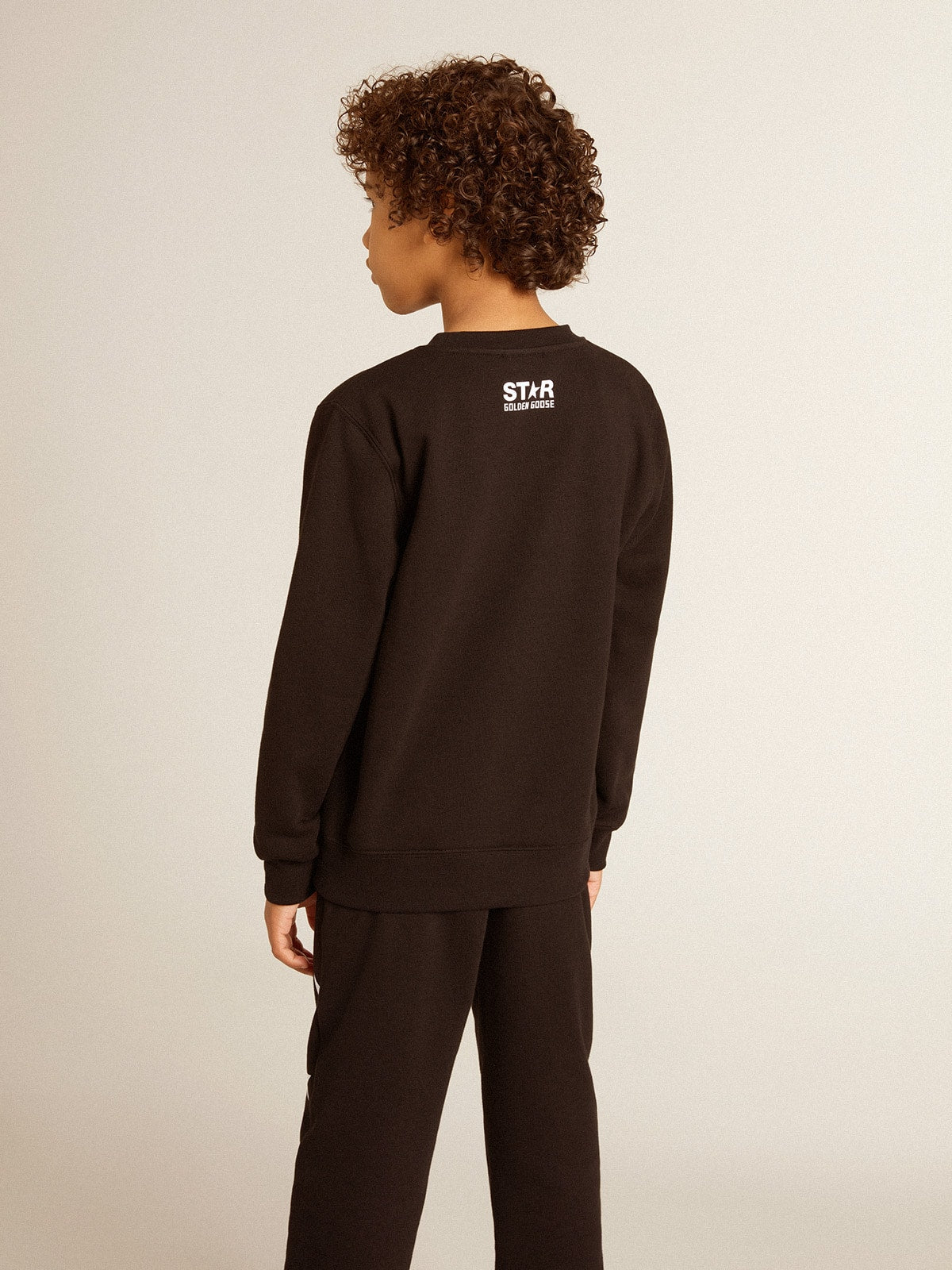 Golden Goose Boys’ black sweatshirt with white maxi star on the front