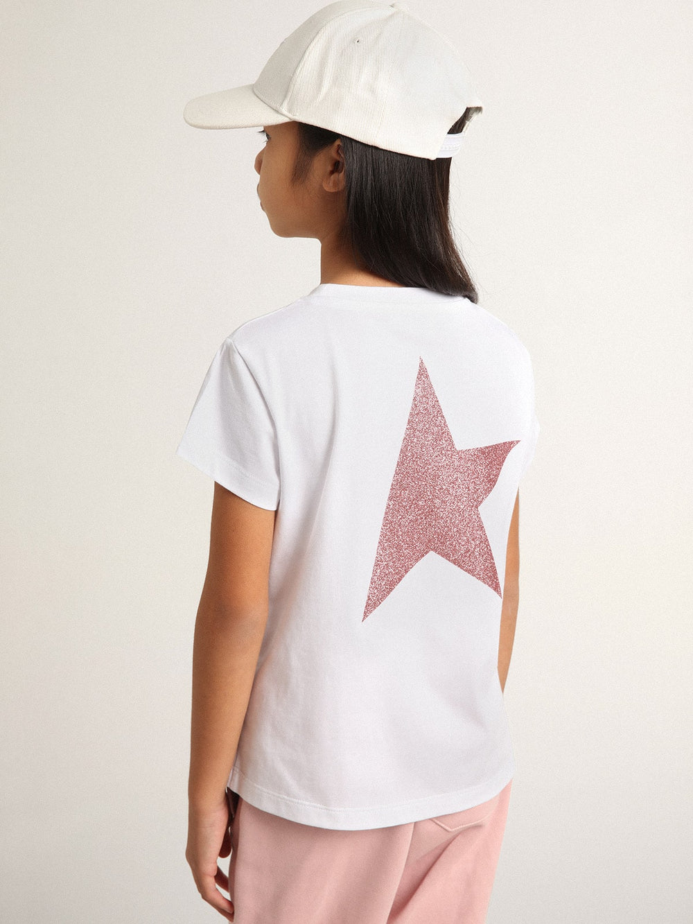 Golden Goose Girls’ white T-shirt with pink glitter logo and maxi star