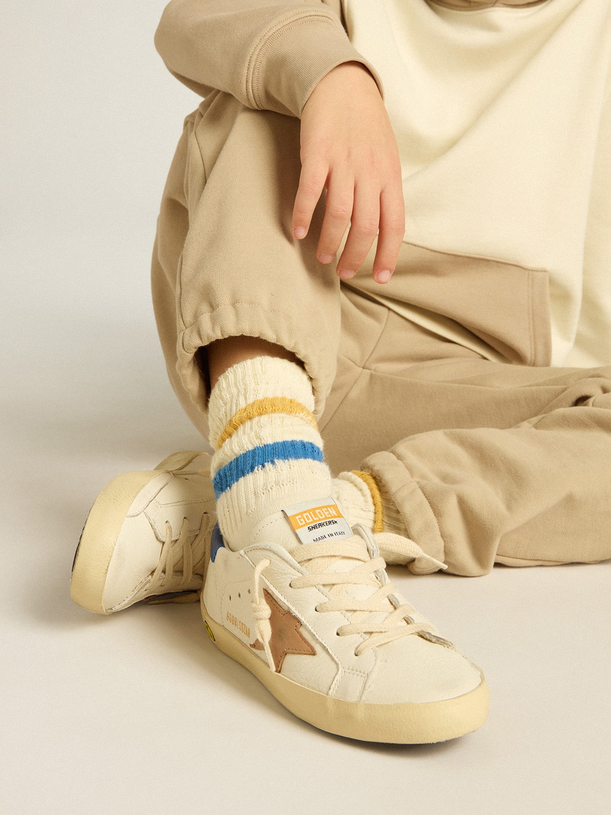 Golden Goose Worn white Kids socks with distressed details and two-tone bright blue and mustard stripes