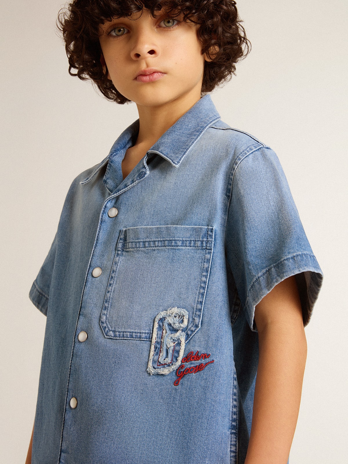Golden Goose Kids’ denim shorts with embroidery on the back