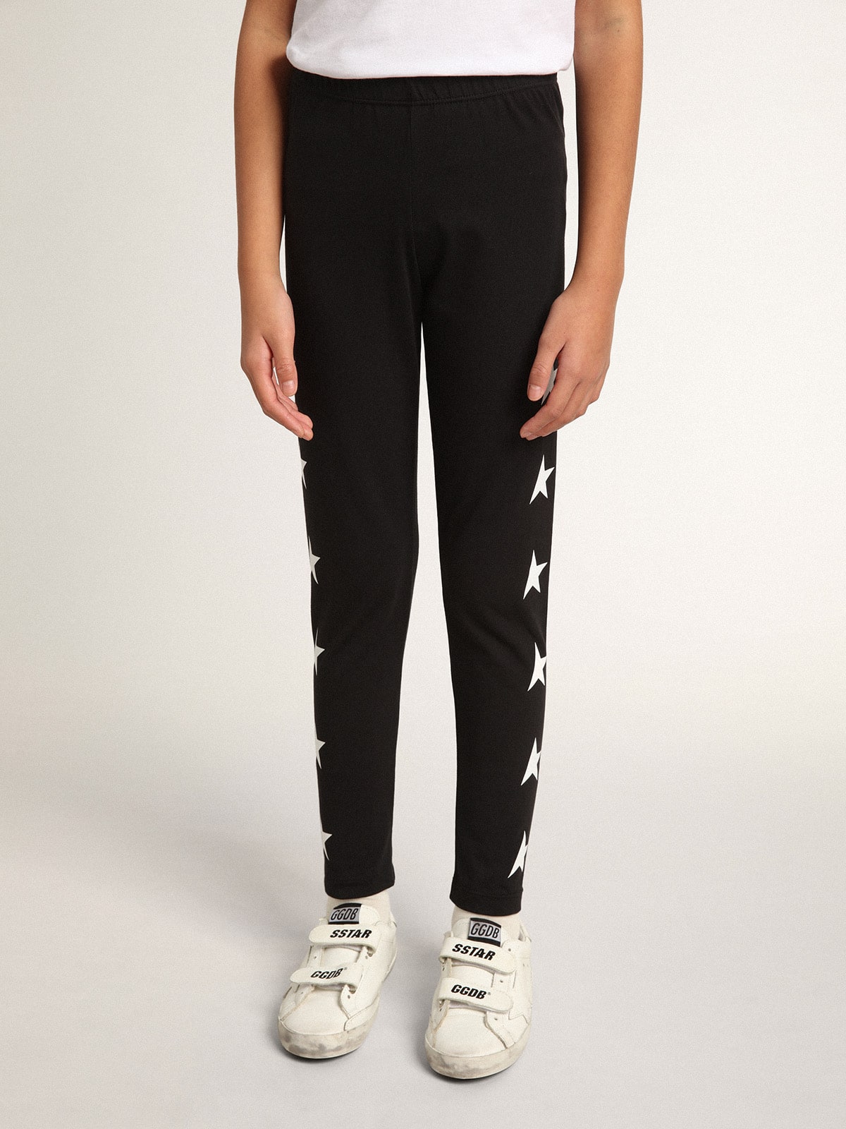 Golden Goose Girls’ black leggings with white stars on the sides