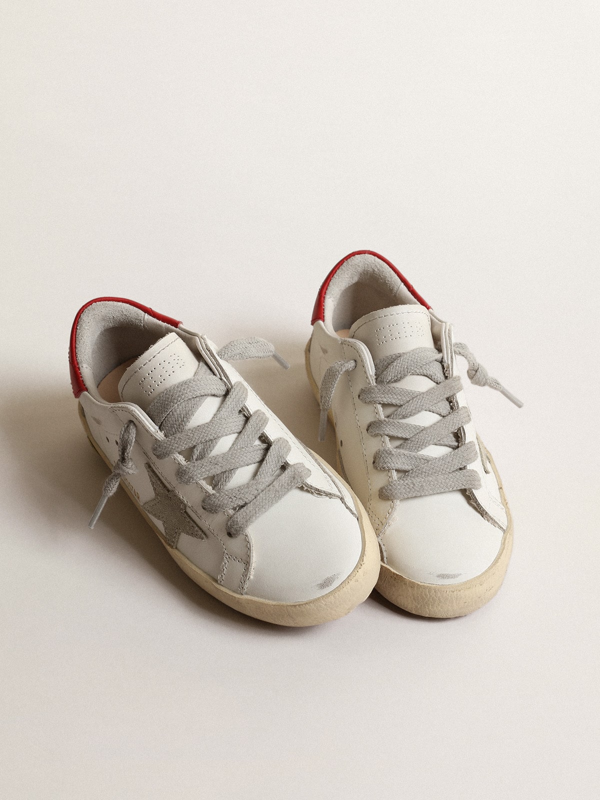 Golden Goose Super-Star Junior with suede star and red leather heel tab