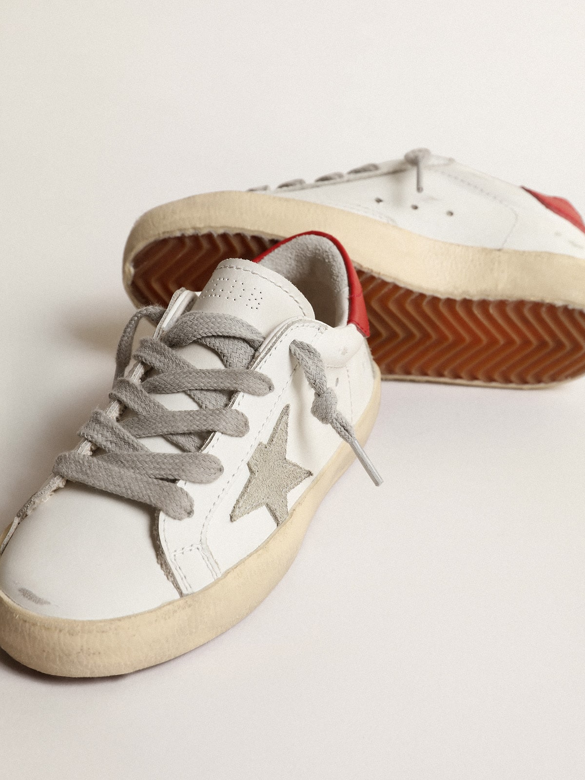 Golden Goose Super-Star Junior with suede star and red leather heel tab