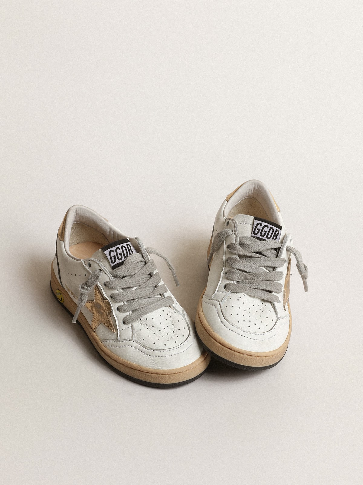 Golden Goose Ball Star Young with gold metallic leather star and heel tab