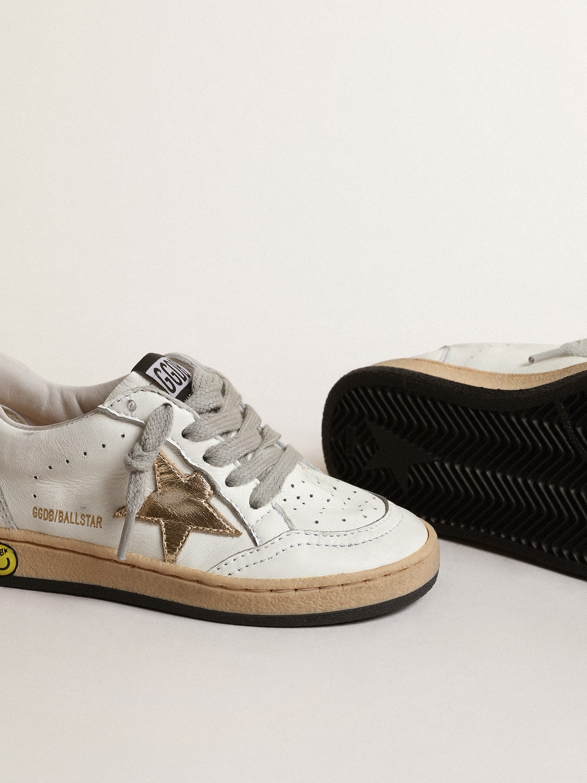 Golden Goose Ball Star Young with gold metallic leather star and heel tab