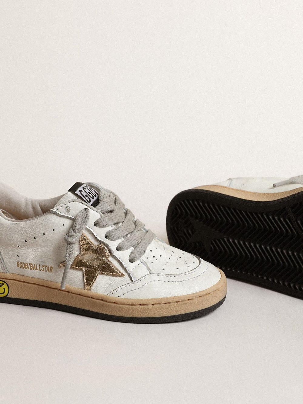 Golden Goose Ball Star Young with gold metallic leather star and heel tab