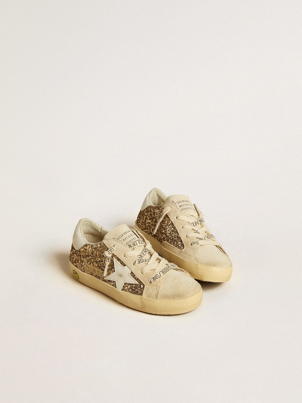 Golden Goose Super-Star Young in gold glitter with white leather star and heel tab