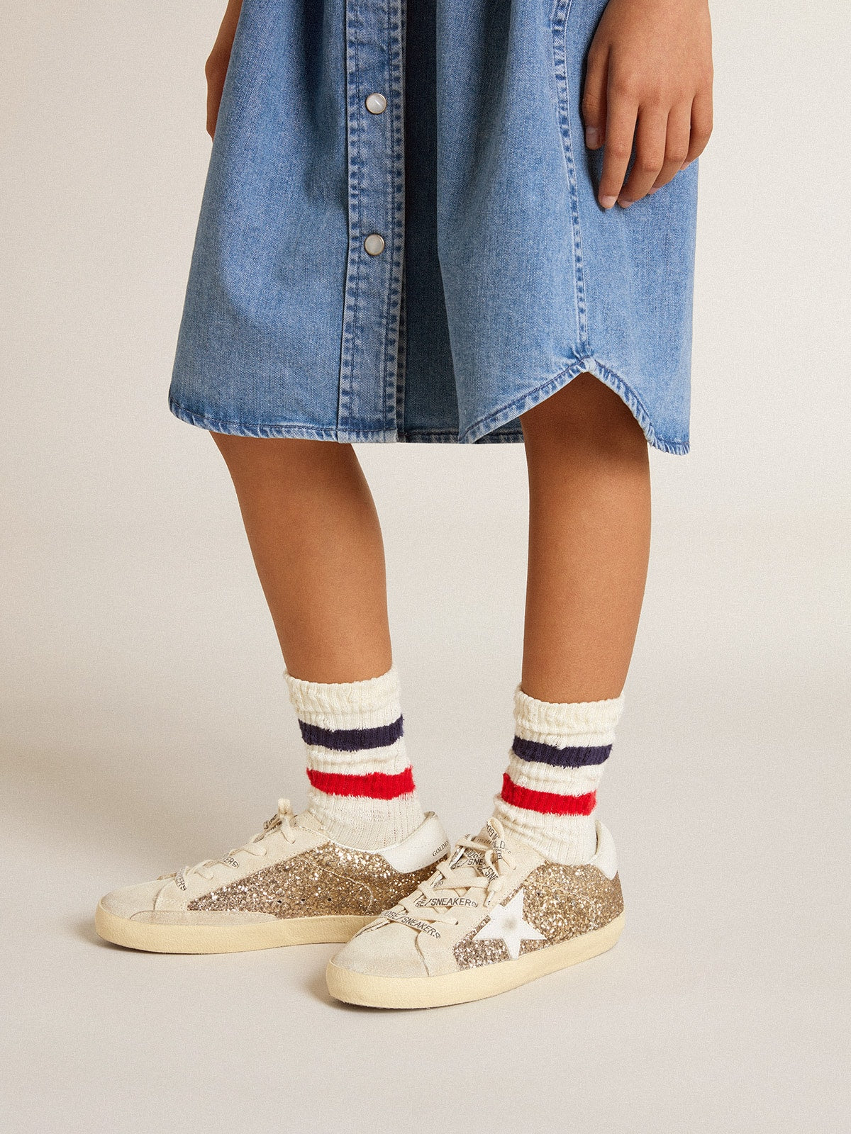 Golden Goose Super-Star Young in gold glitter with white leather star and heel tab